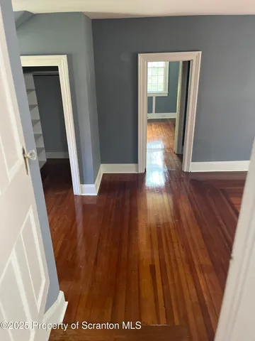 a view of a room that has a window in it