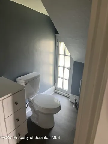 a bathroom with a sink and a window