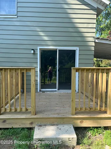 a view of a door of the house with a window