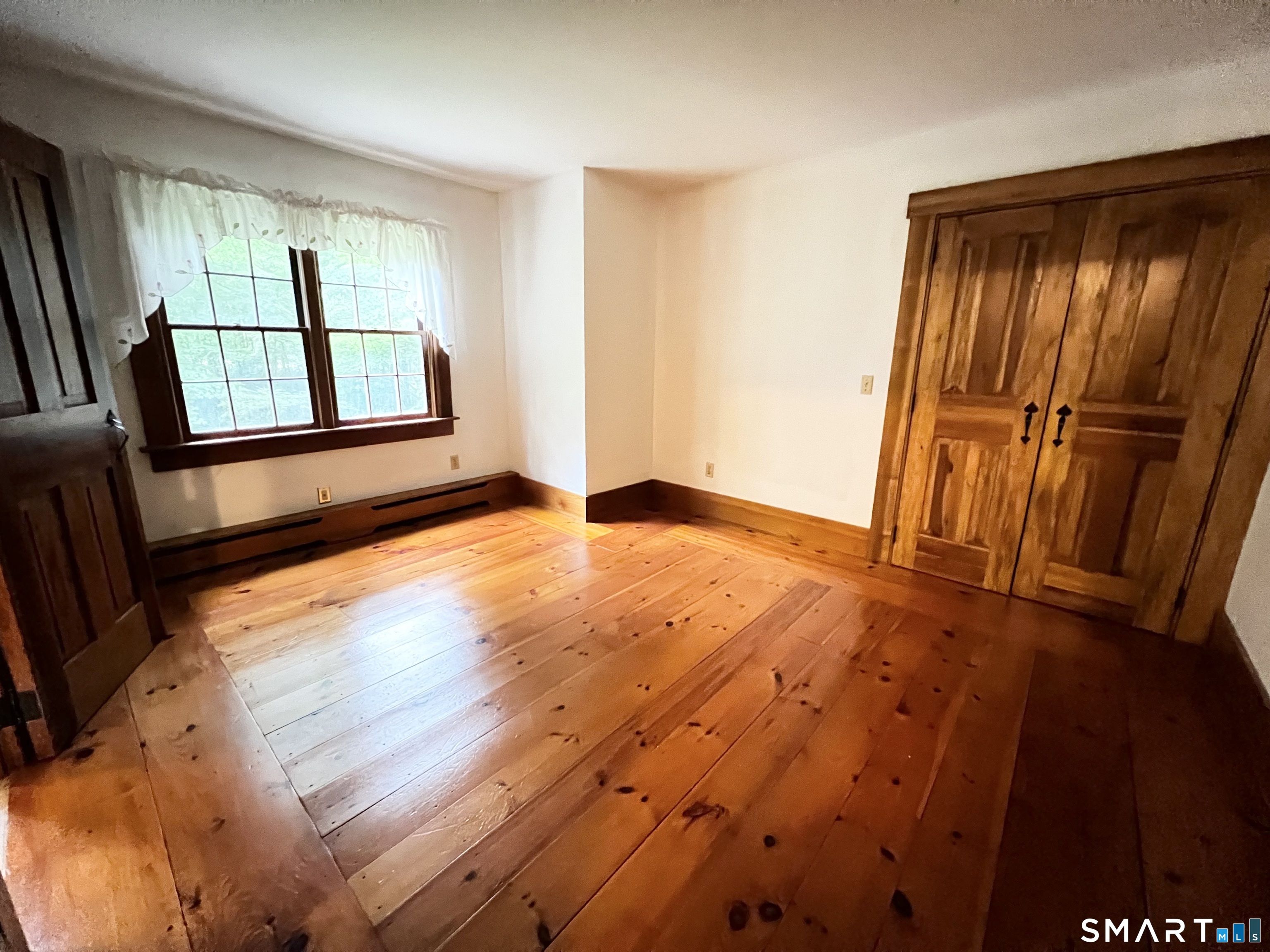 38 Clark Hill Road East Haddam, CT 06423 - Photo 28 of 35 wooden floor in an empty room with a window