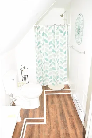 a bathroom with a bathtub and shower