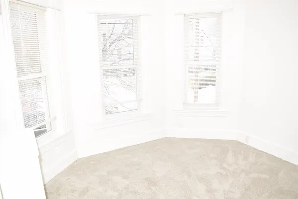 a view of an empty room and window