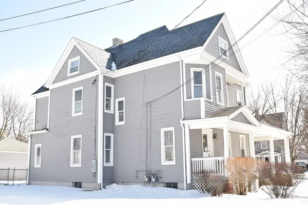 a view of a white building among the street