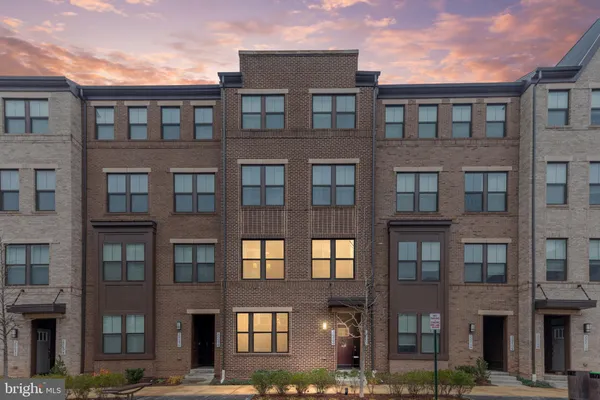 a front view of a building with glass windows