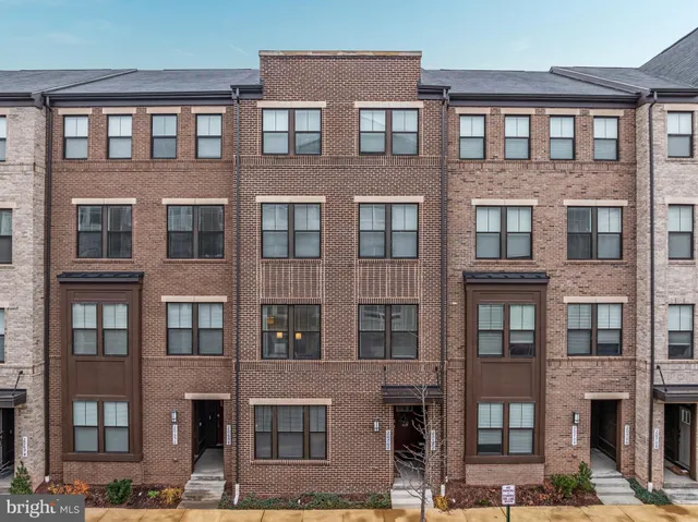 a front view of a building with glass windows