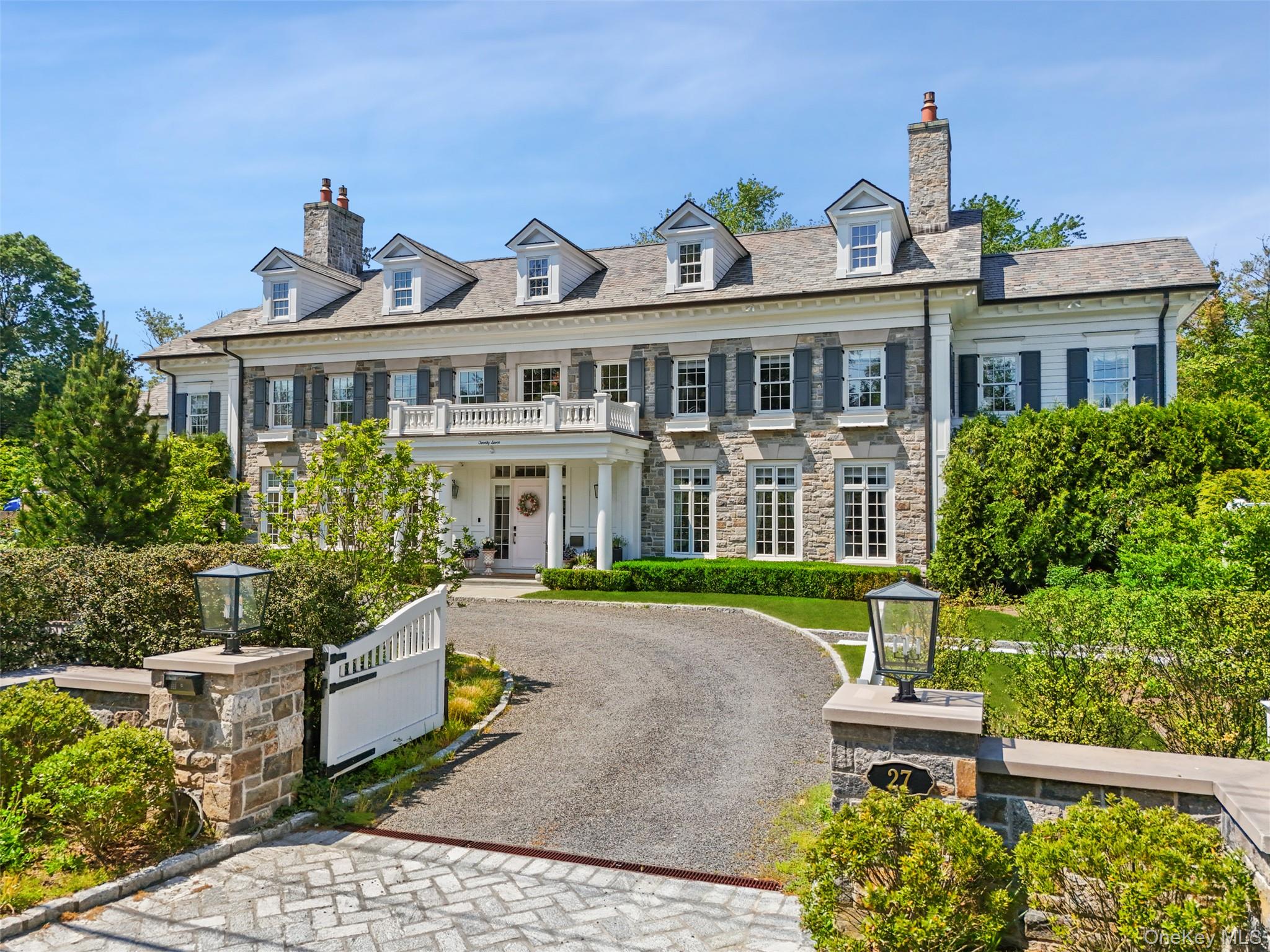 27 Murray Hill Road Scarsdale, NY 10583 - Photo 25 of 29 a front view of a house with garden