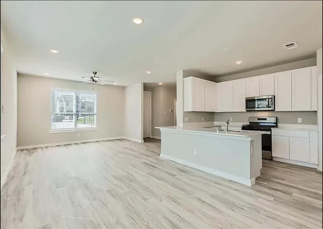 a bathroom with a sink vanity and a mirror