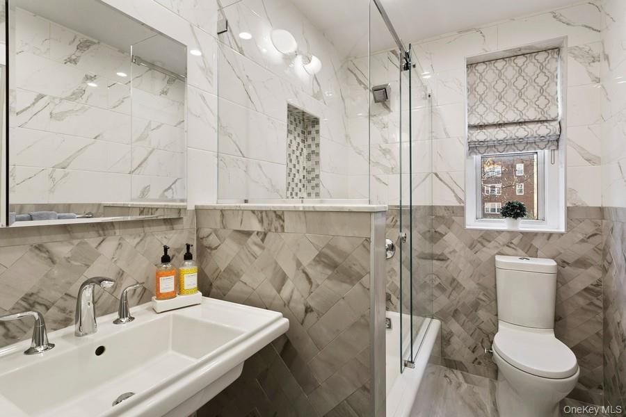 250 Bronxville Road, Unit 3I Bronxville, NY 10708 - Photo 13 of 17 a bathroom with a sink toilet and shower