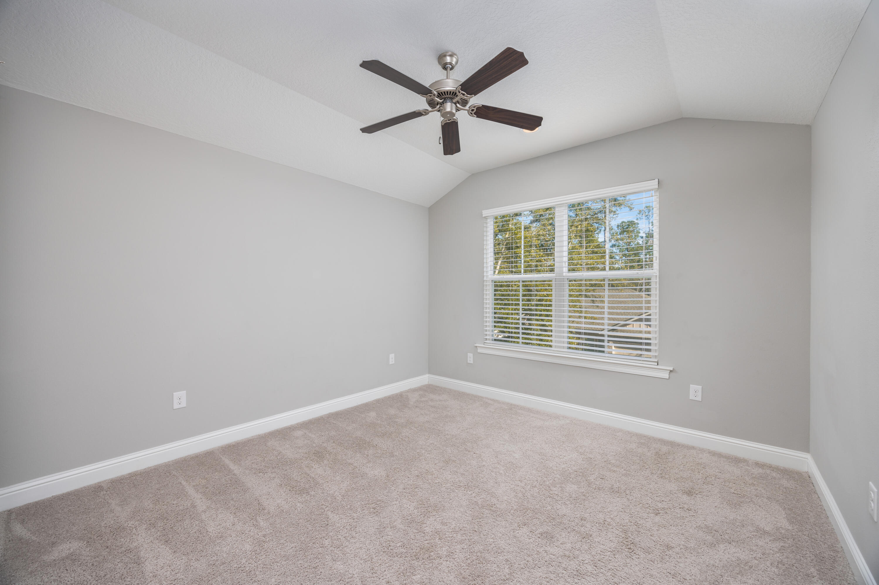 134 Laurel Oaks Drive Freeport, FL 32439 - Photo 28 of 30 an empty room with ceiling fan and window
