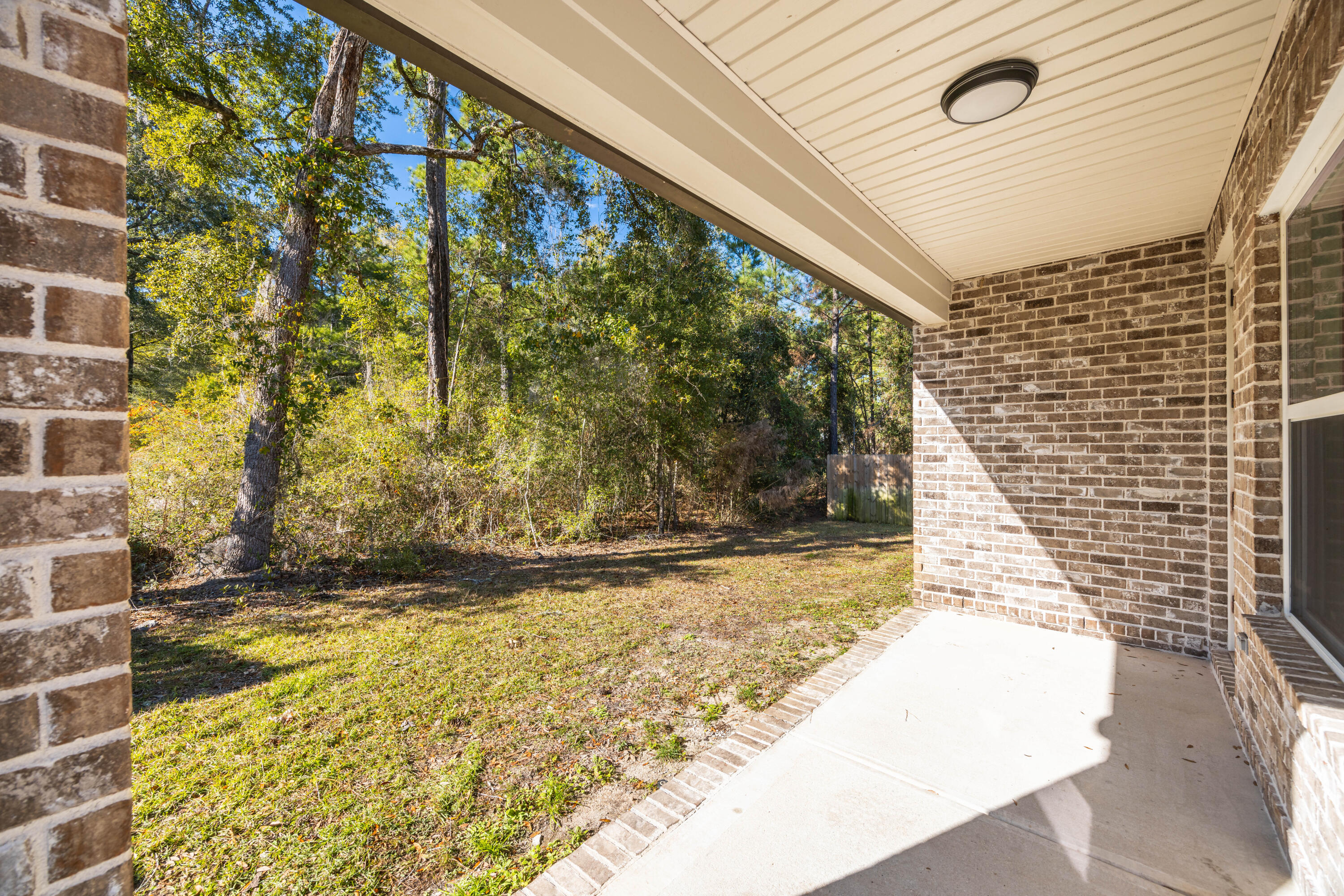 134 Laurel Oaks Drive Freeport, FL 32439 - Photo 29 of 30 a view of a pathway both side of house