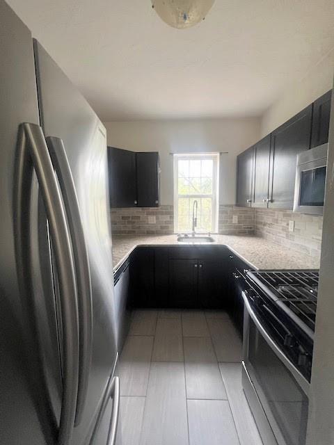358 Pointview Road Pittsburgh, PA 15227 - Photo 3 of 12 a kitchen with a refrigerator and a sink