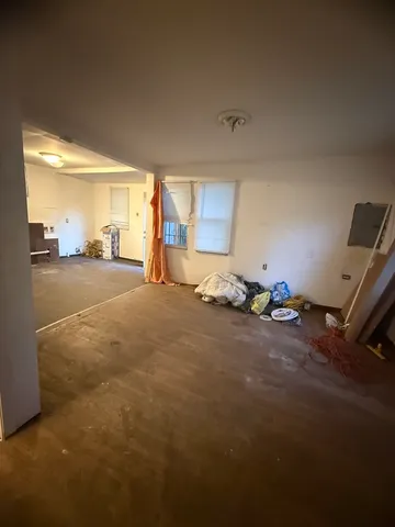 a room with a bed and window