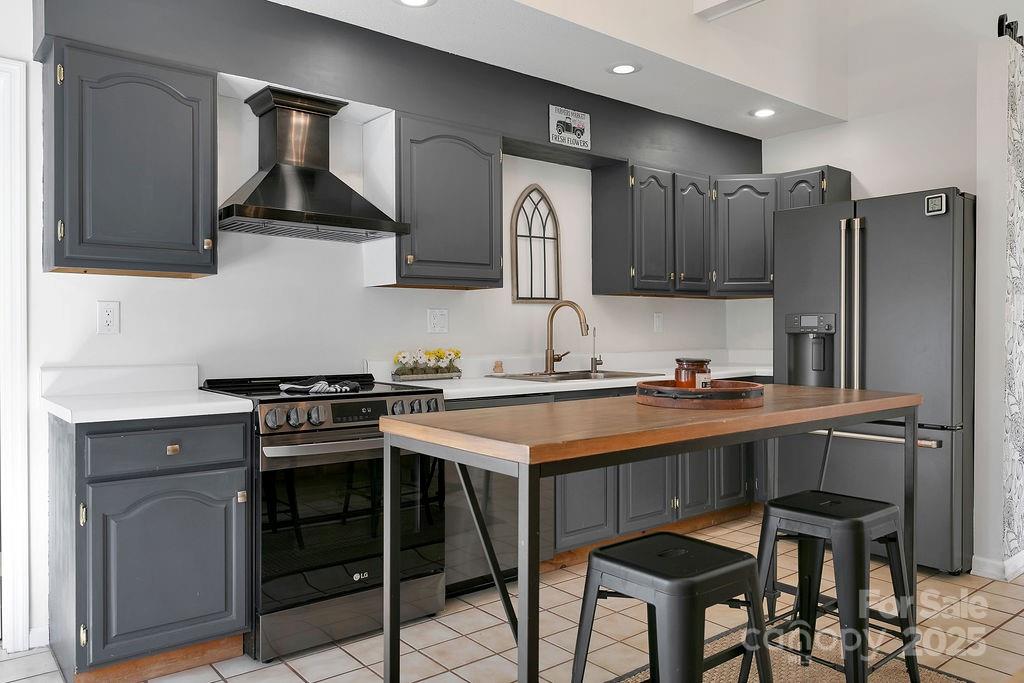 1881 Becky Mountain Road Brevard, NC 28712 - Photo 13 of 40 a kitchen with stainless steel appliances granite countertop a stove a sink dishwasher and a refrigerator