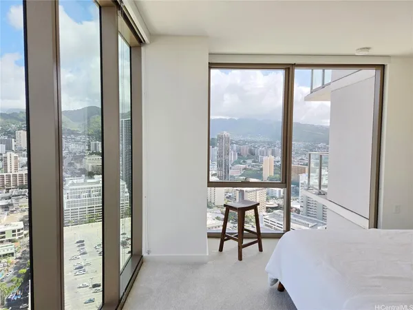 a bedroom with furniture and a window