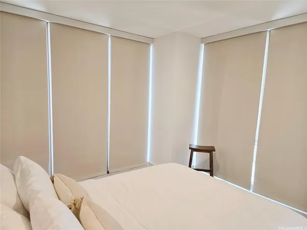 a bedroom with a bed and a shower