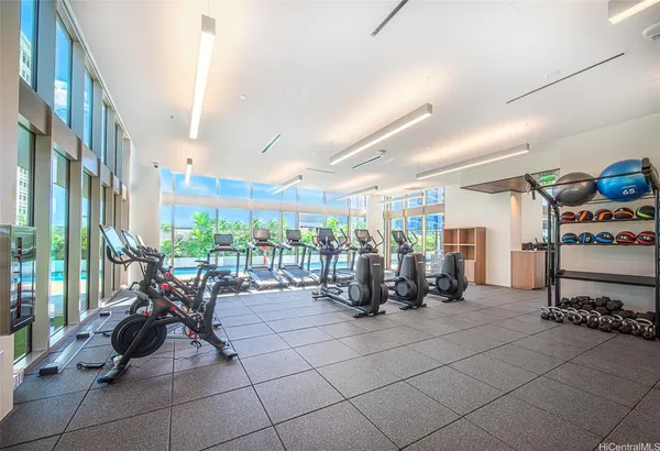 a view of a chair and table in the back yard of the house