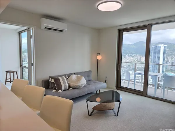 a living room with furniture and a large window