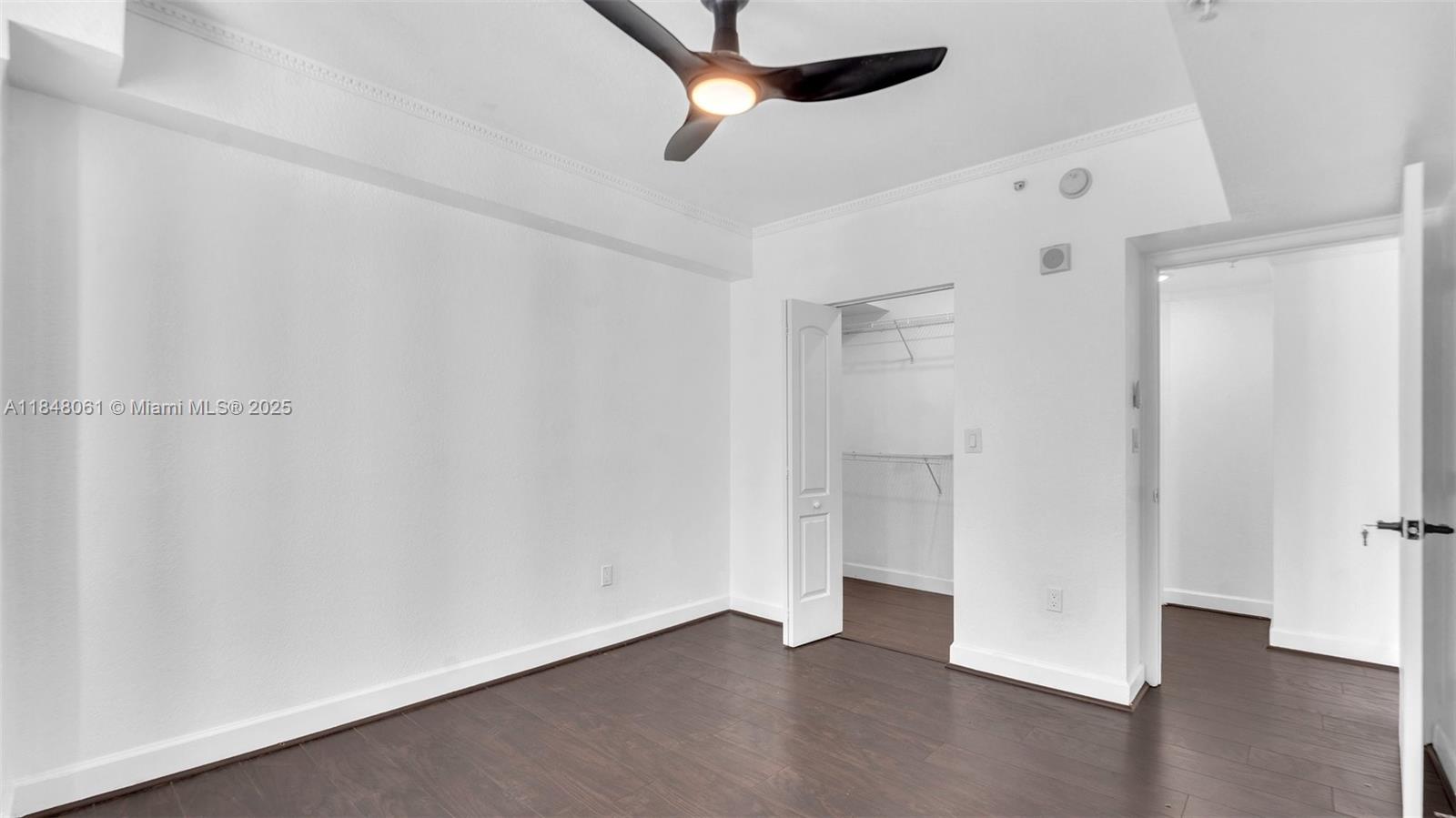 1830 Radius Drive, Unit 405 Hollywood, FL 33020 - Photo 14 of 19 a view of an empty room with a ceiling fan