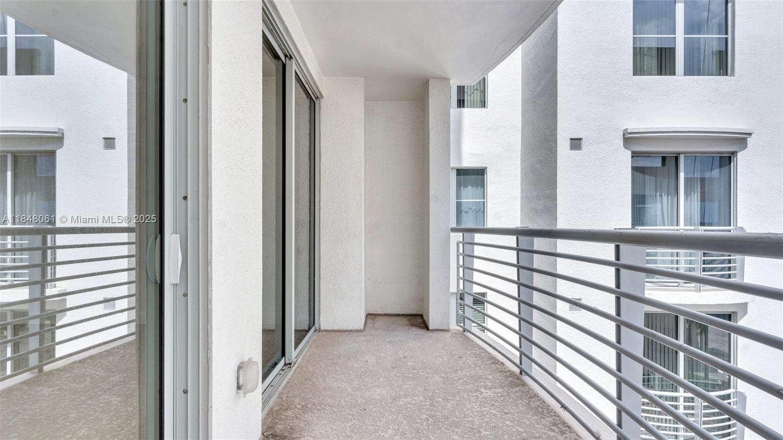 1830 Radius Drive, Unit 405 Hollywood, FL 33020 - Photo 16 of 19 a view of balcony and staircase