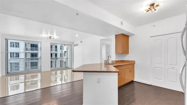 a view of cabinets and wooden floor