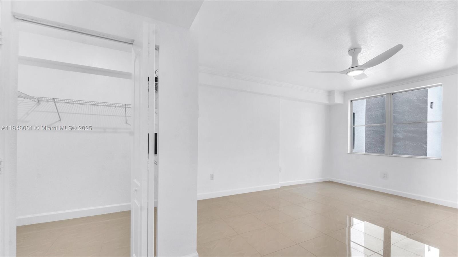 1830 Radius Drive, Unit 405 Hollywood, FL 33020 - Photo 6 of 19 a view of an empty room with a window