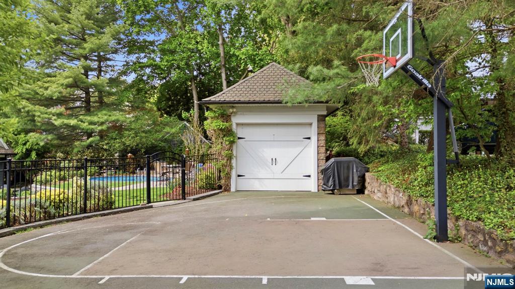 203 Heights Road Ridgewood, NJ 07450 - Photo 33 of 41 a front view of a house with a yard and garage