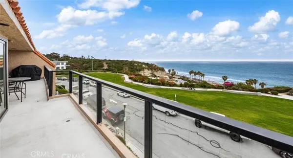 a view of swimming pool from a balcony