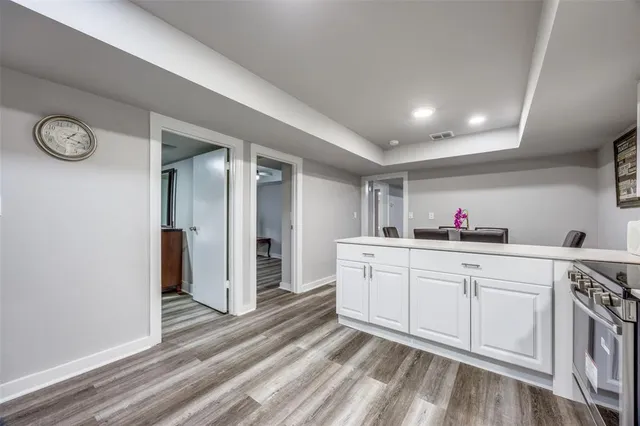 a spacious bathroom with a sink and a mirror
