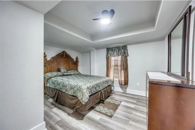 a bedroom with a bed and a dresser