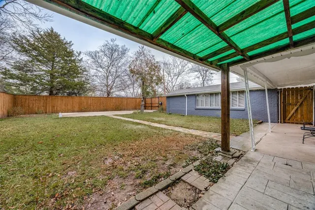 a view of a backyard with a garden