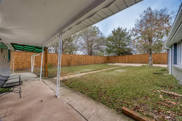a view of backyard with outdoor space