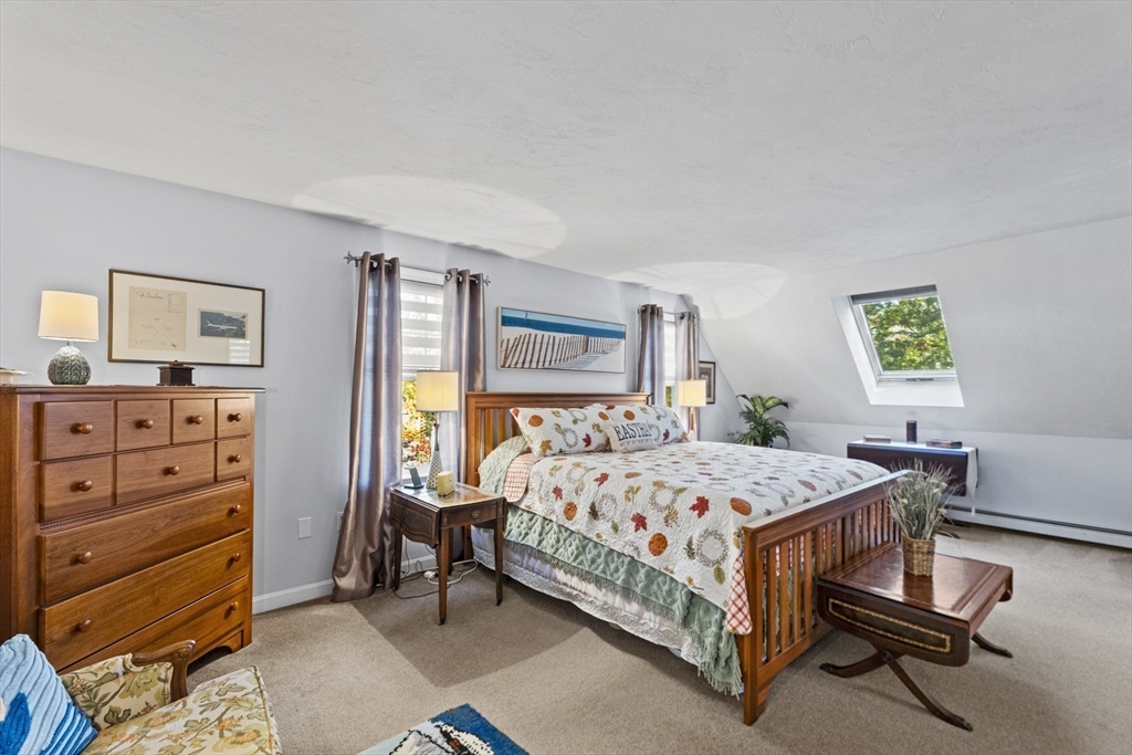 100 Orchard Drive Eastham, MA 02642 - Photo 16 of 31 a bedroom with a bed and a dresser in it