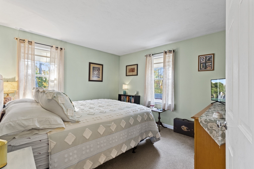 100 Orchard Drive Eastham, MA 02642 - Photo 18 of 31 a bedroom with a bed and a couch