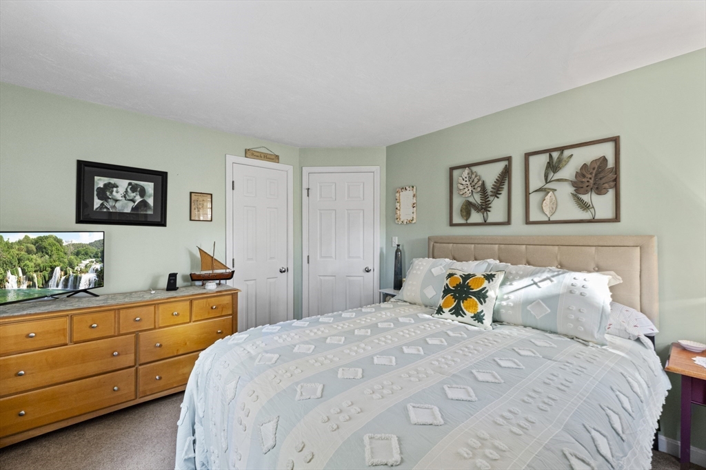 100 Orchard Drive Eastham, MA 02642 - Photo 19 of 31 a bedroom with a bed and closet