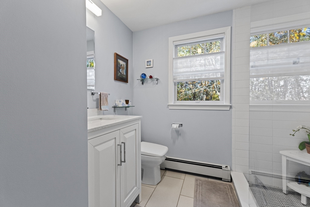 100 Orchard Drive Eastham, MA 02642 - Photo 22 of 31 a bathroom with a sink toilet and a window
