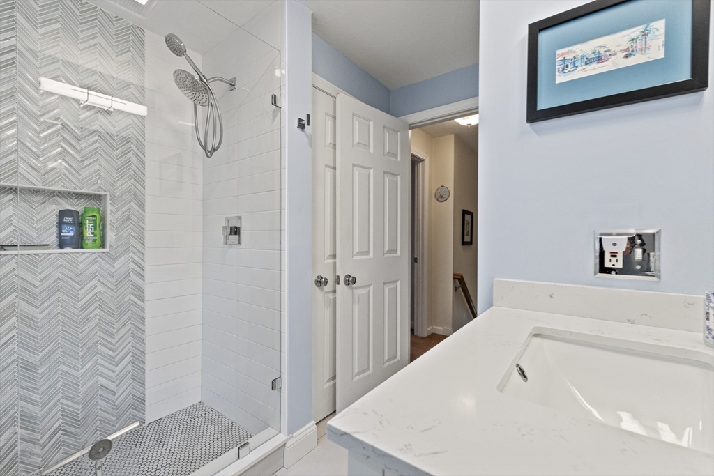 100 Orchard Drive Eastham, MA 02642 - Photo 23 of 31 a bathroom with a bathtub and a shower