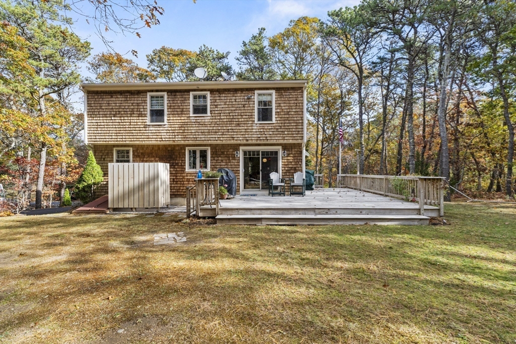 100 Orchard Drive Eastham, MA 02642 - Photo 24 of 31 a view of a house with swimming pool and sitting area