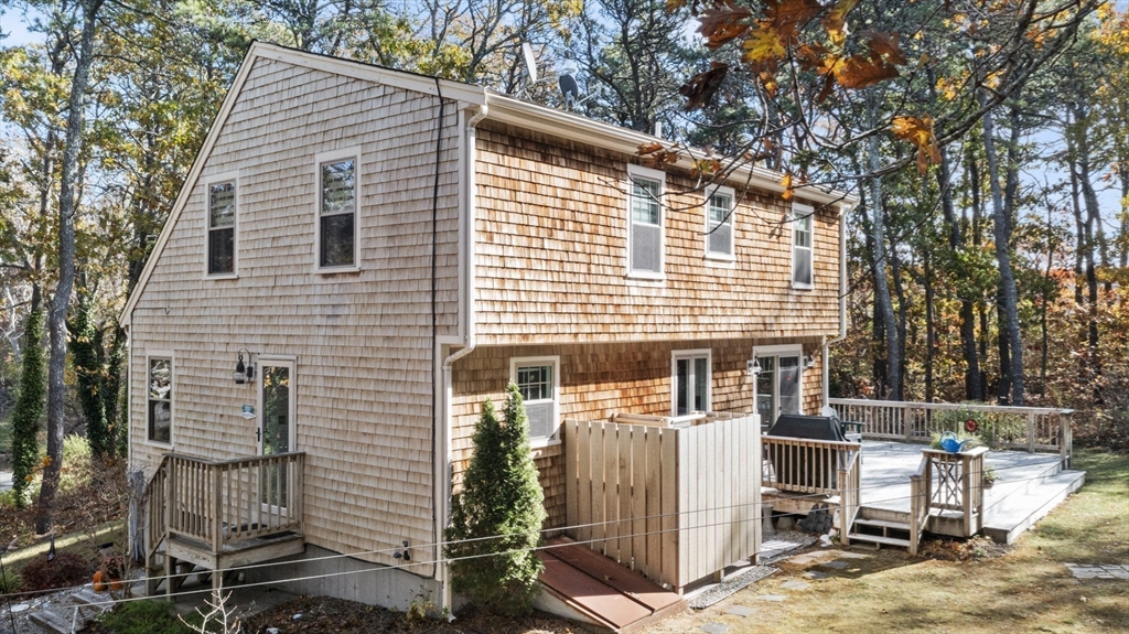 100 Orchard Drive Eastham, MA 02642 - Photo 25 of 31 a view of a house with a patio