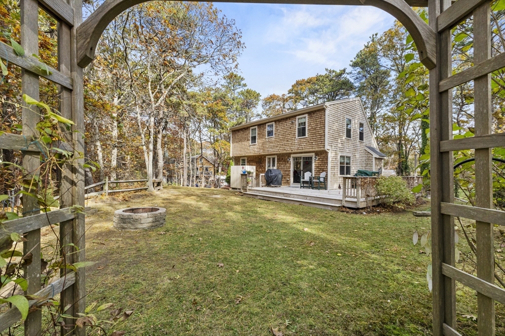 100 Orchard Drive Eastham, MA 02642 - Photo 27 of 31 a view of a house with a yard