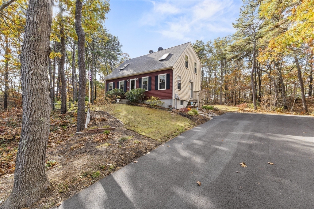 100 Orchard Drive Eastham, MA 02642 - Photo 29 of 31 a view of a house with a yard covered in snow