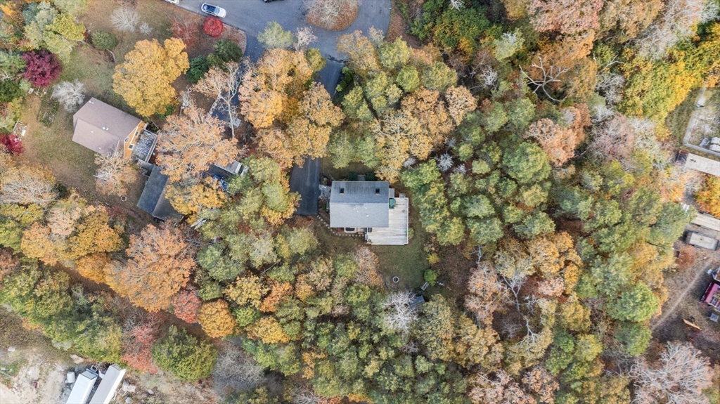 100 Orchard Drive Eastham, MA 02642 - Photo 30 of 31 a backyard of a house with a yard and garden