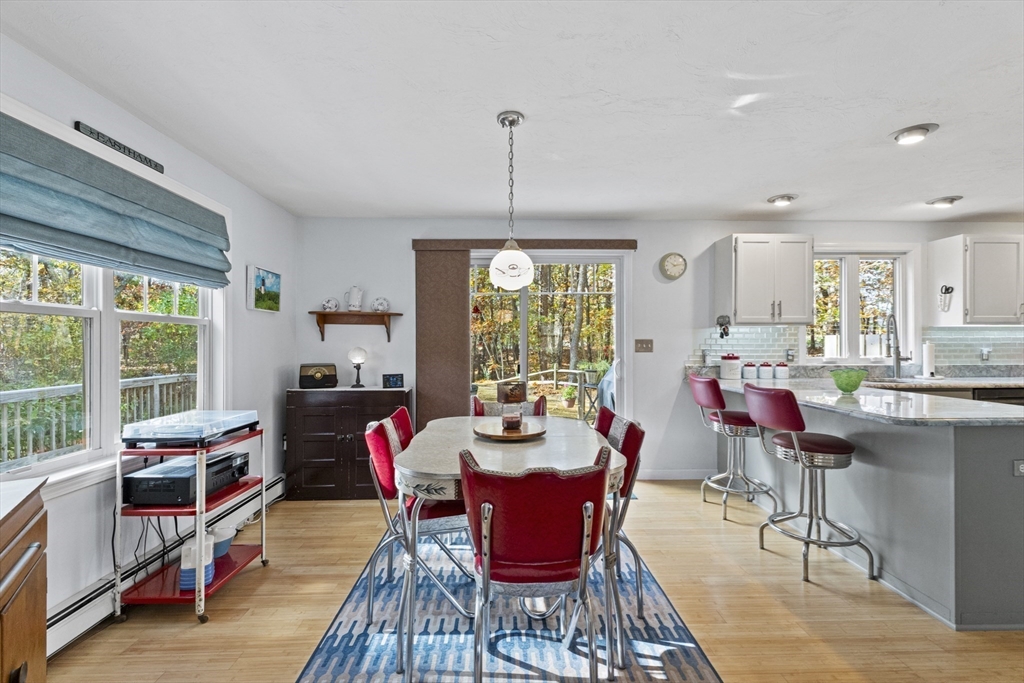 100 Orchard Drive Eastham, MA 02642 - Photo 6 of 31 a dining room with furniture window and wooden floor