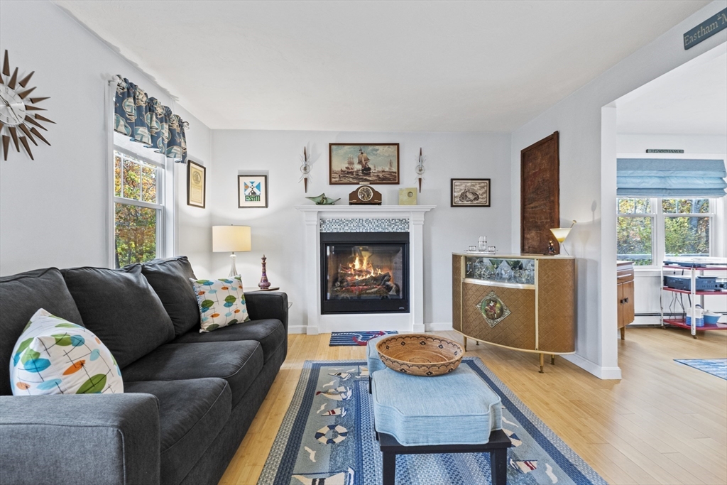 100 Orchard Drive Eastham, MA 02642 - Photo 7 of 31 a living room with furniture and a fireplace