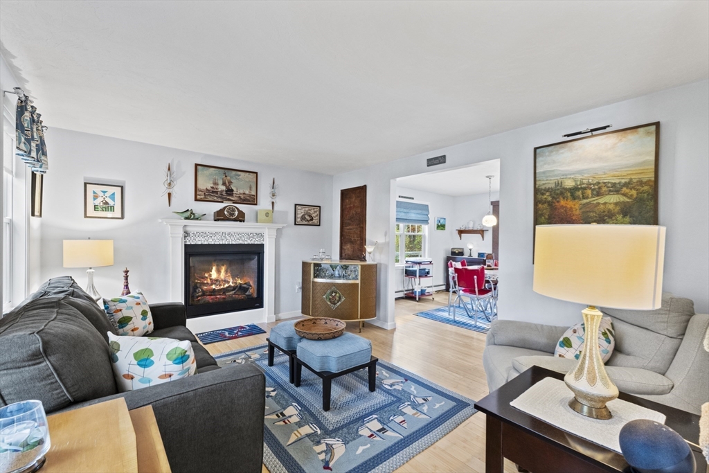 100 Orchard Drive Eastham, MA 02642 - Photo 8 of 31 a living room with furniture and a fireplace
