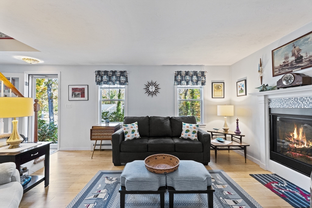 100 Orchard Drive Eastham, MA 02642 - Photo 9 of 31 a living room with furniture and a fireplace