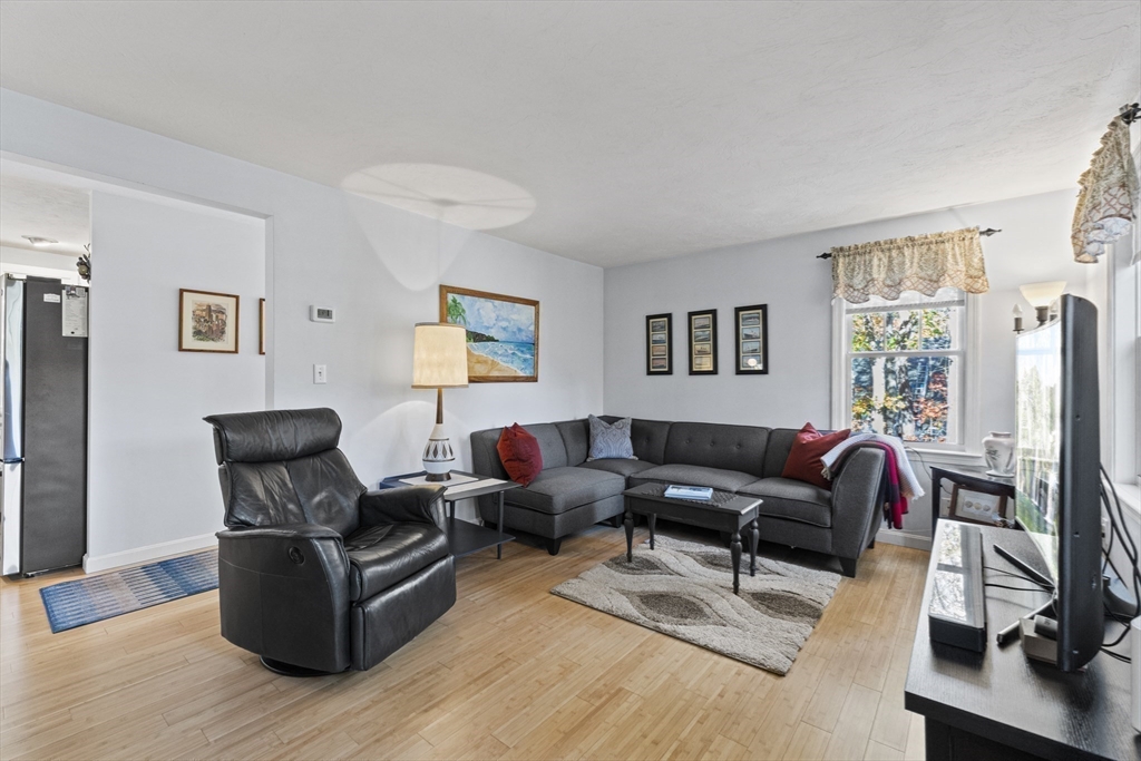 100 Orchard Drive Eastham, MA 02642 - Photo 10 of 31 a living room with furniture flat screen tv and a window