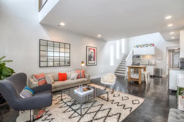 a living room with furniture and a table