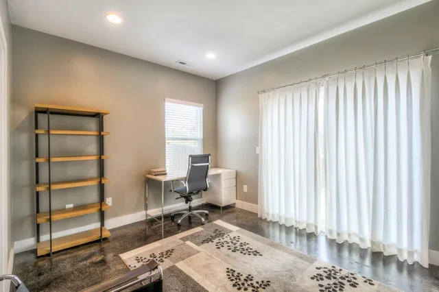 a workspace with furniture and a window