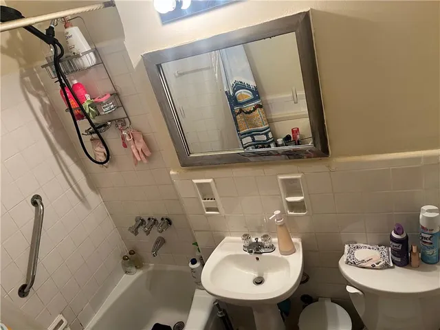 a bathroom with a sink mirror and vanity