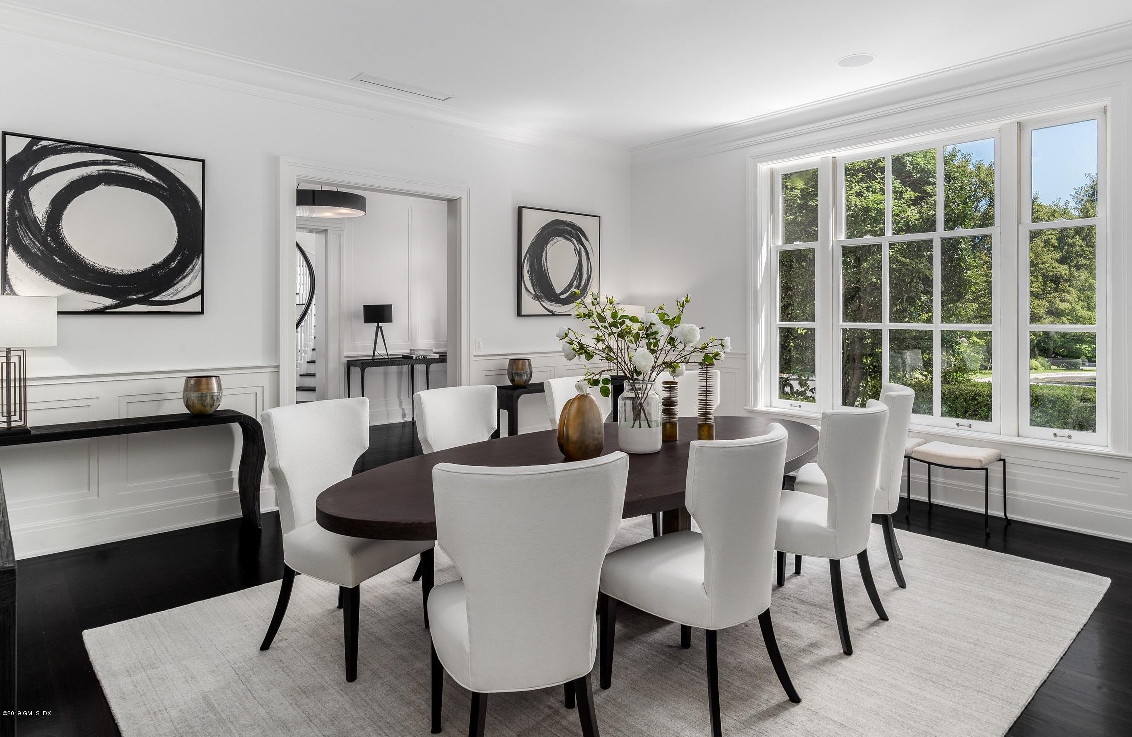 16 Andrews Farm Road Greenwich, CT 06831 - Photo 13 of 44 a dining room with furniture a window and a chandelier